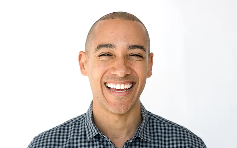 Smiling man in a gray shirt