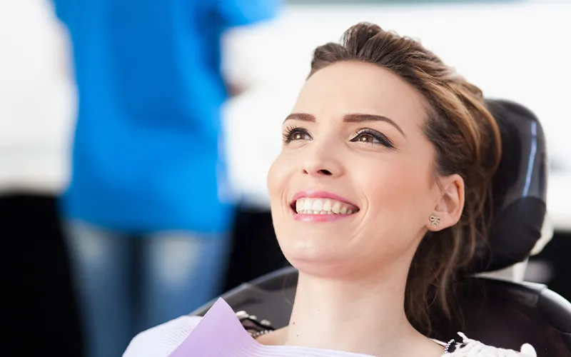 A smiling girl in the dentist's chair